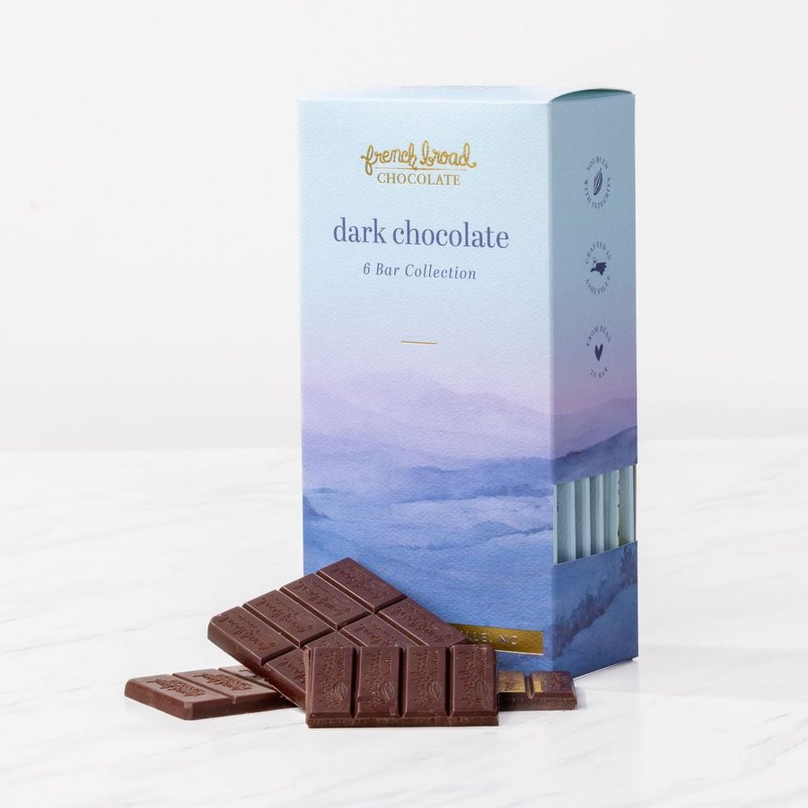 The dark chocolate 6 bar collection box with dark chocolate bars on marble