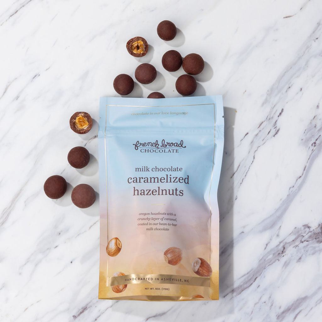 A bag of chocolate-covered hazelnuts
